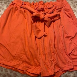 Full circle orange shorts.
